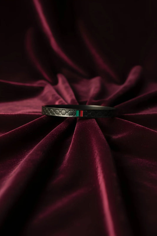 Sleek Matte Black Bangle with Signature Stripe Accent