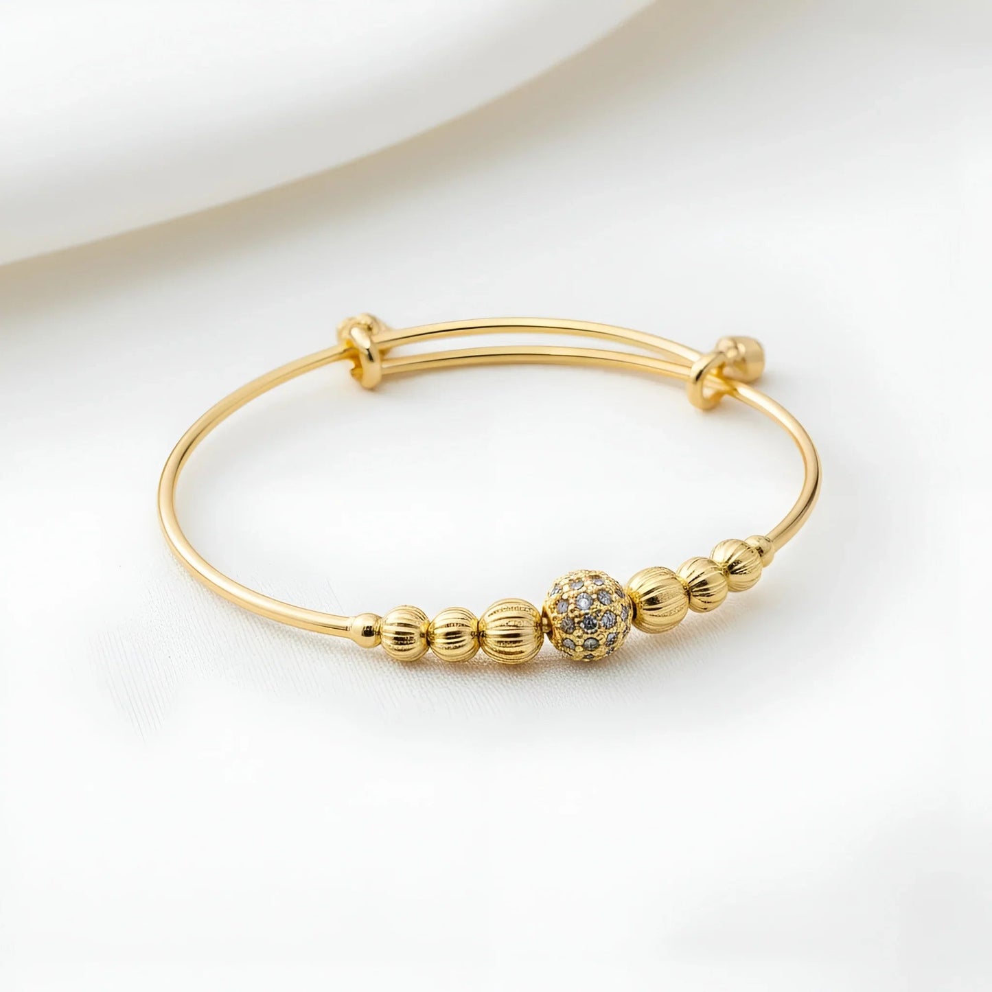 Adjustable Gold-Toned Bangle with Sparkling Pave Bead
